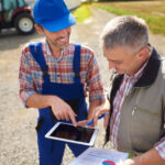 High angle view on modern farmers with digital tablet